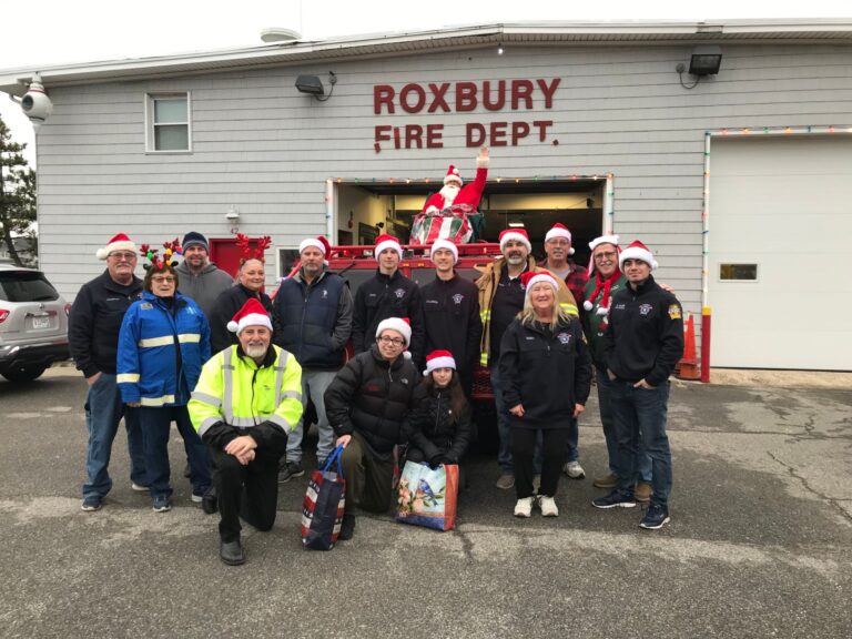 members in front of the station with Santa