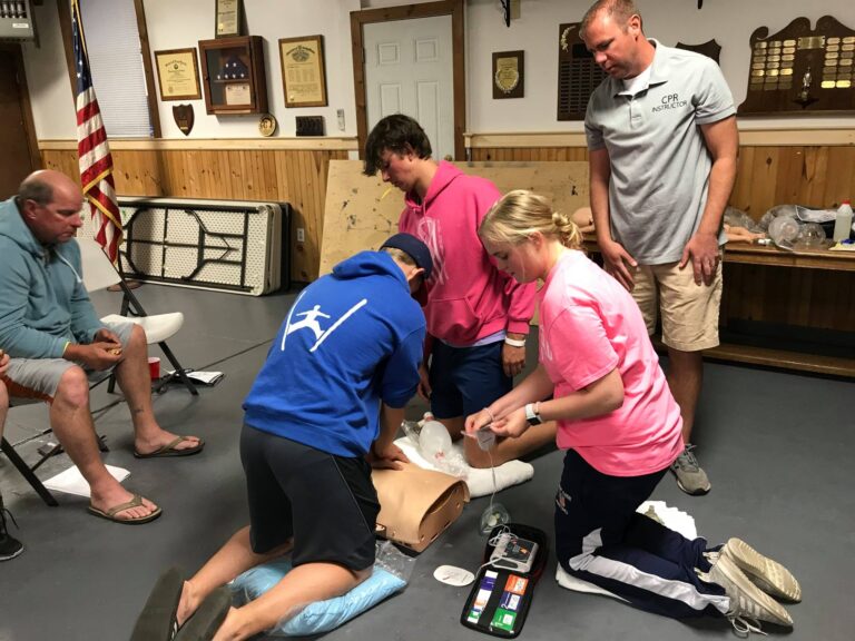 Teens and members learning CPR